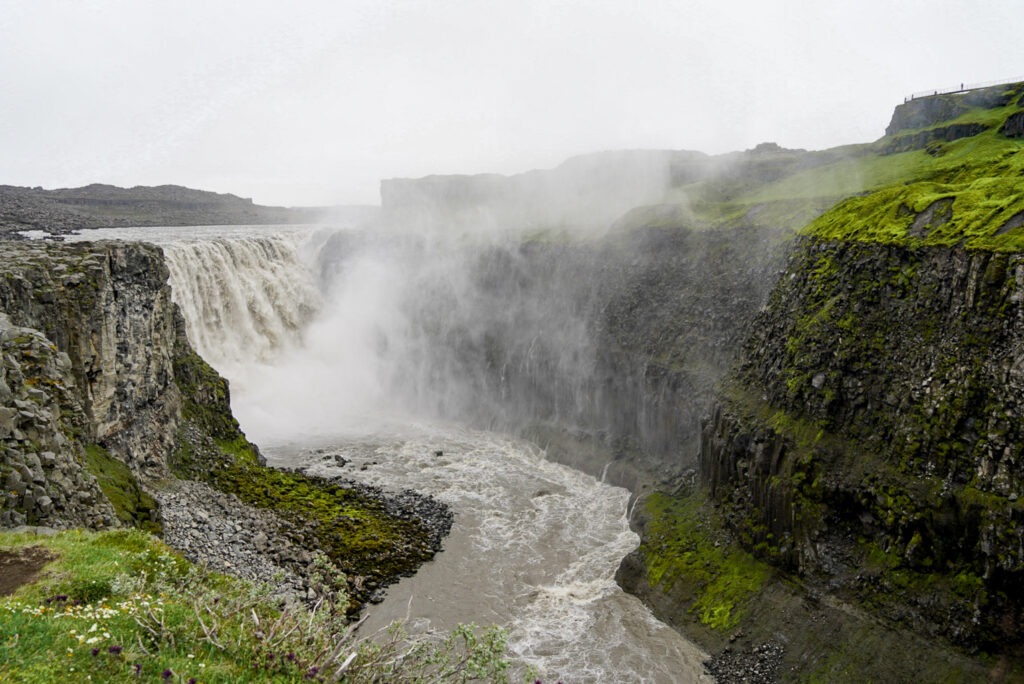 water flowing at dettifoss waterfall